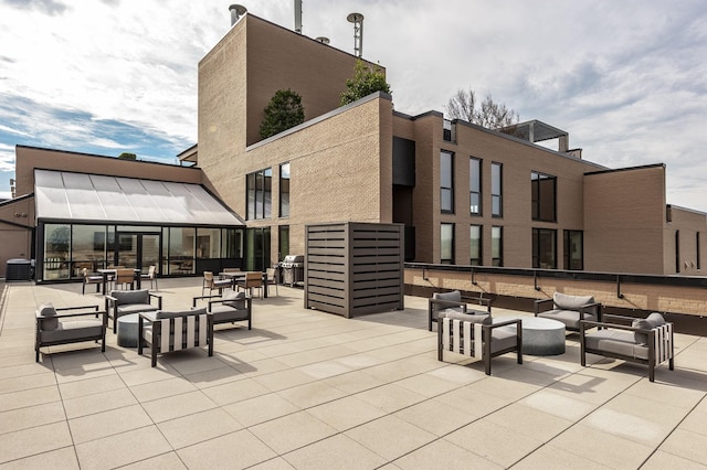 view of patio with an outdoor hangout area, grilling area, and cooling unit