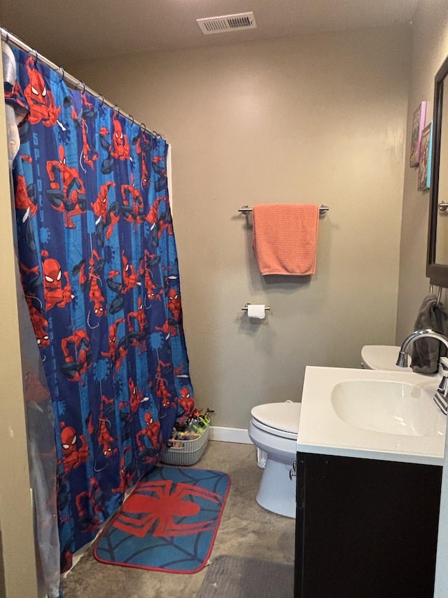 bathroom with vanity and toilet