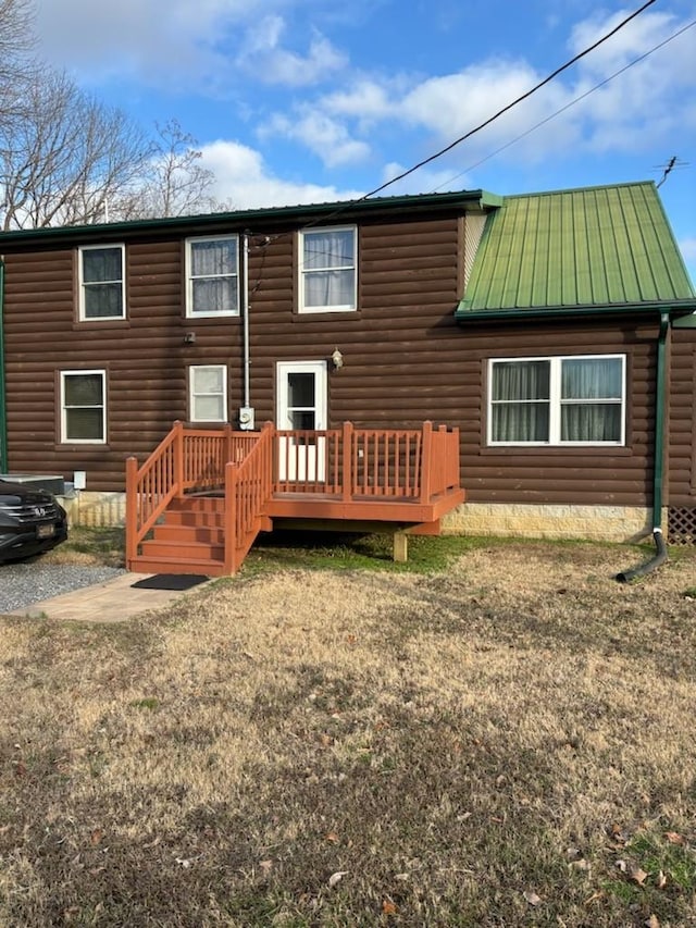 back of property featuring a wooden deck