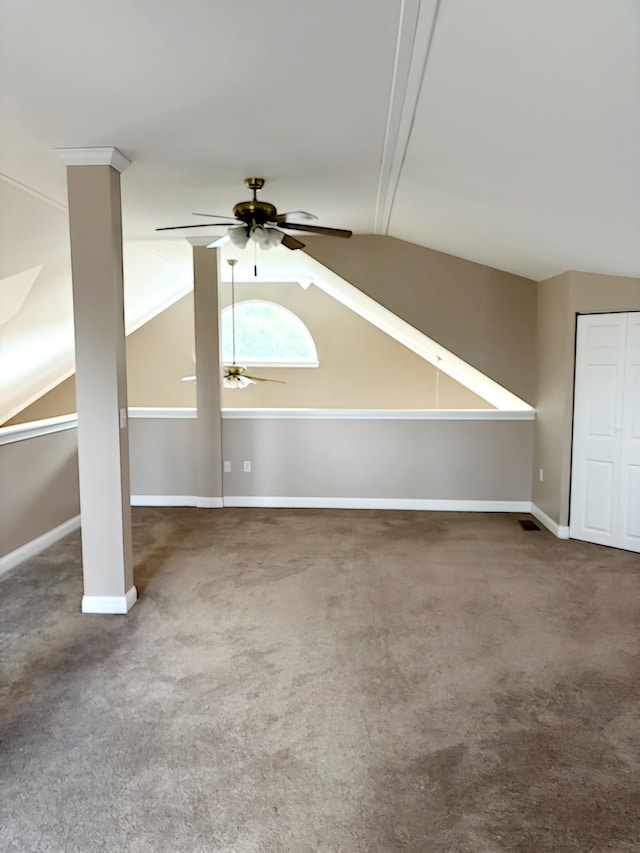 additional living space with carpet, ceiling fan, and vaulted ceiling