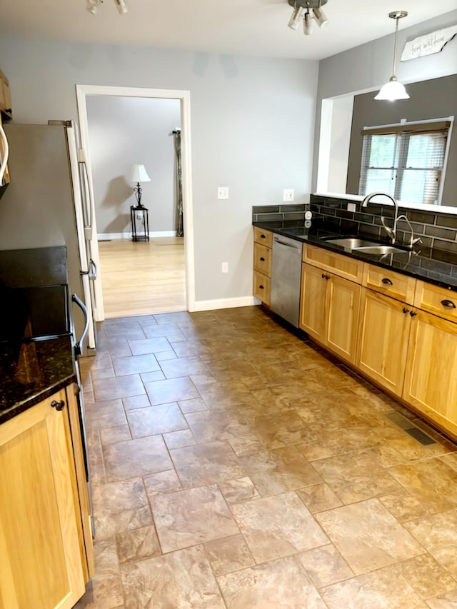 kitchen with ceiling fan, sink, pendant lighting, white refrigerator, and dishwasher