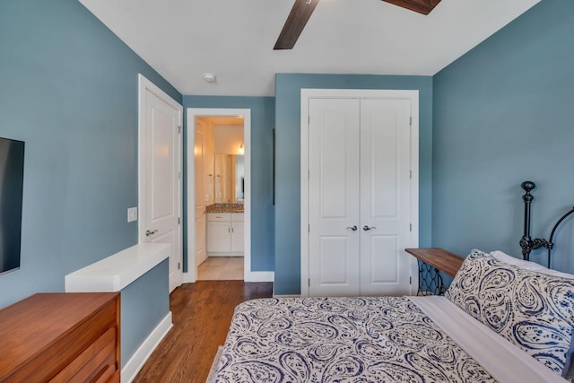 bedroom with ceiling fan, dark hardwood / wood-style floors, connected bathroom, and a closet