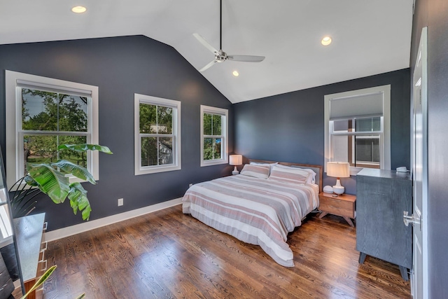 bedroom with ceiling fan, dark hardwood / wood-style flooring, and vaulted ceiling