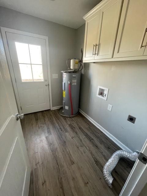 clothes washing area with cabinets, electric water heater, dark hardwood / wood-style floors, and hookup for an electric dryer