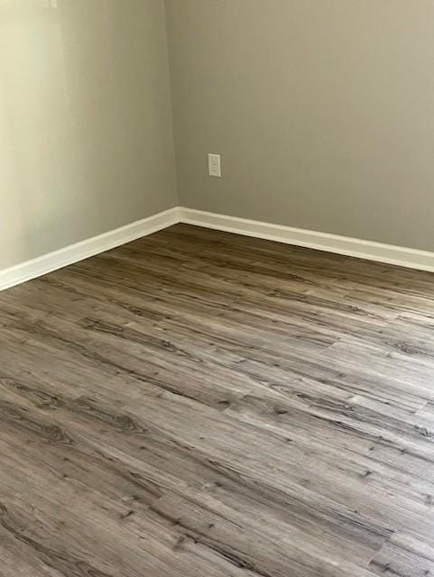 unfurnished room featuring hardwood / wood-style flooring