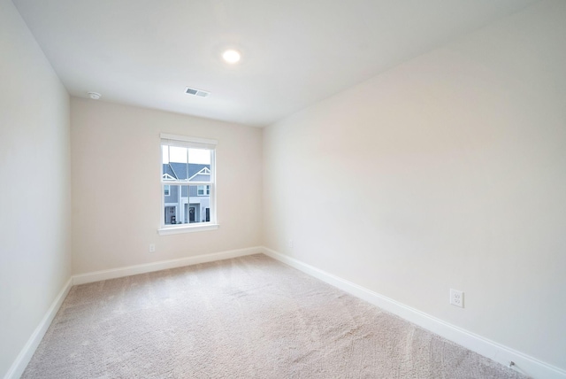 spare room featuring carpet floors