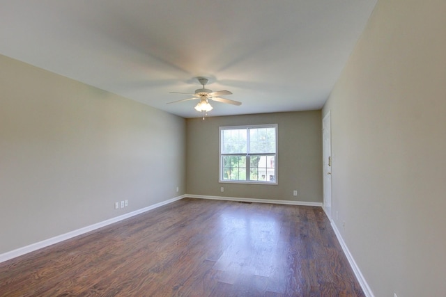 unfurnished room with dark hardwood / wood-style floors and ceiling fan