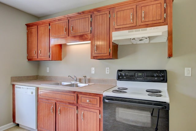 kitchen featuring sink and white appliances