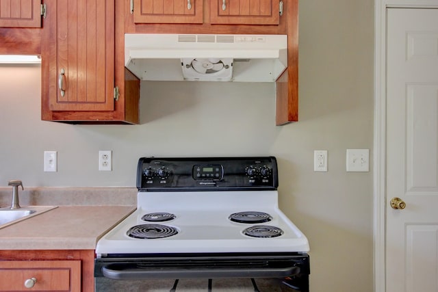 kitchen with white range with electric stovetop and sink