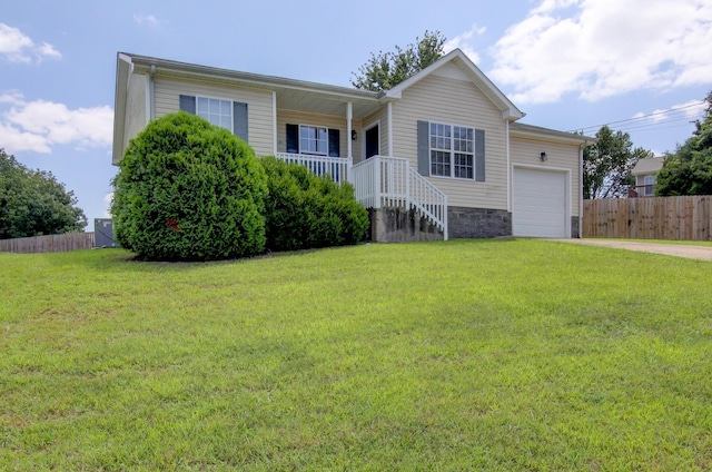 single story home with a front yard and a garage