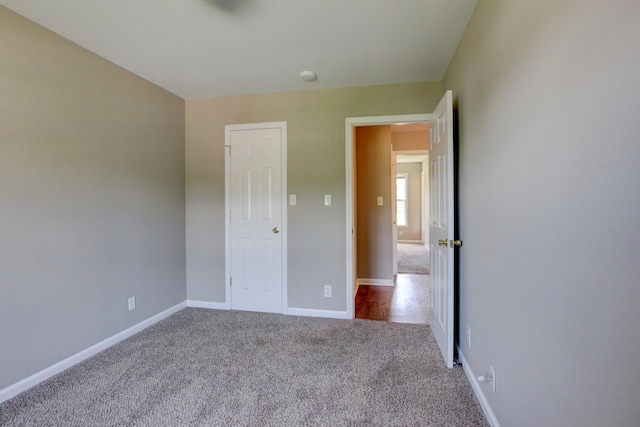 unfurnished bedroom featuring carpet flooring