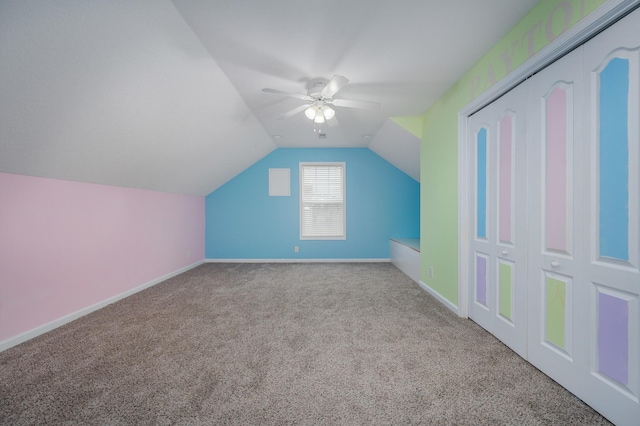 bonus room featuring ceiling fan, light colored carpet, and vaulted ceiling