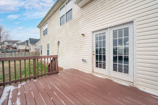 wooden deck featuring a lawn