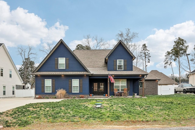 view of front of property with a porch and a front yard