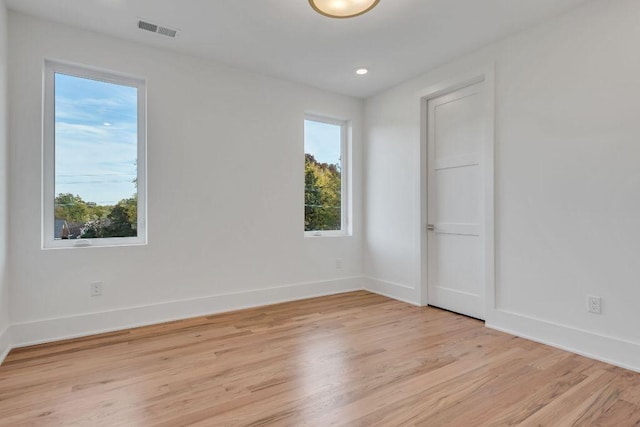 spare room featuring light wood-type flooring