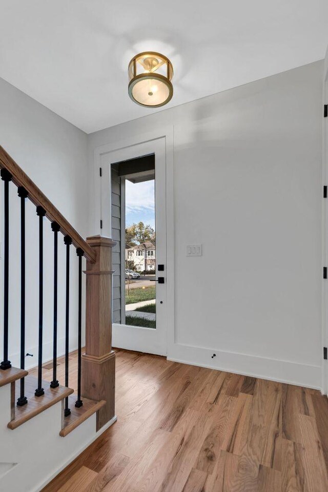 entrance foyer with light wood-type flooring