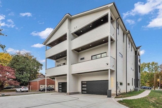 view of front of home with a balcony and a garage