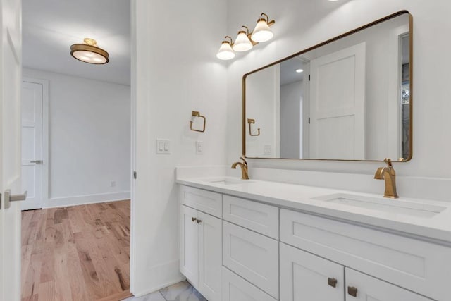 bathroom featuring vanity and hardwood / wood-style flooring