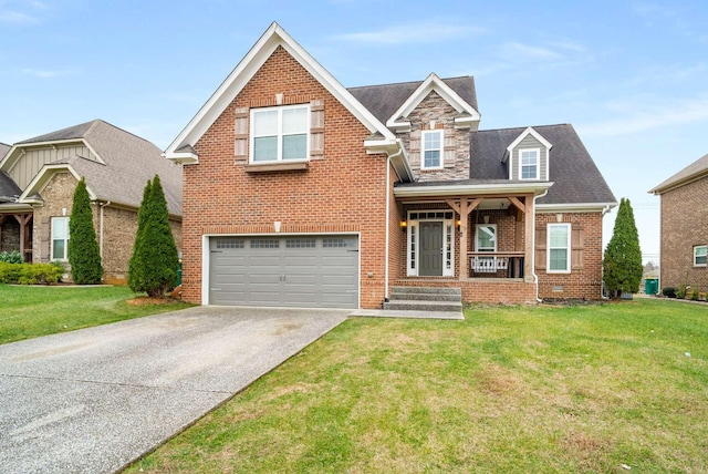 view of front of property featuring a garage, a porch, and a front lawn