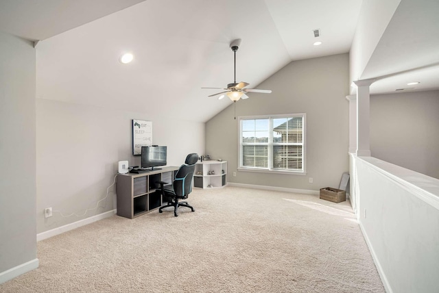 carpeted office with lofted ceiling and ceiling fan