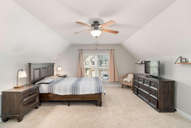 carpeted bedroom featuring vaulted ceiling and ceiling fan