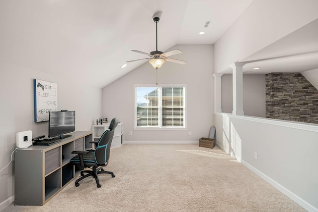 home office featuring ceiling fan, vaulted ceiling, and light carpet