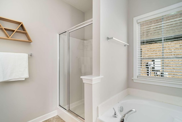 bathroom featuring shower with separate bathtub and tile patterned floors