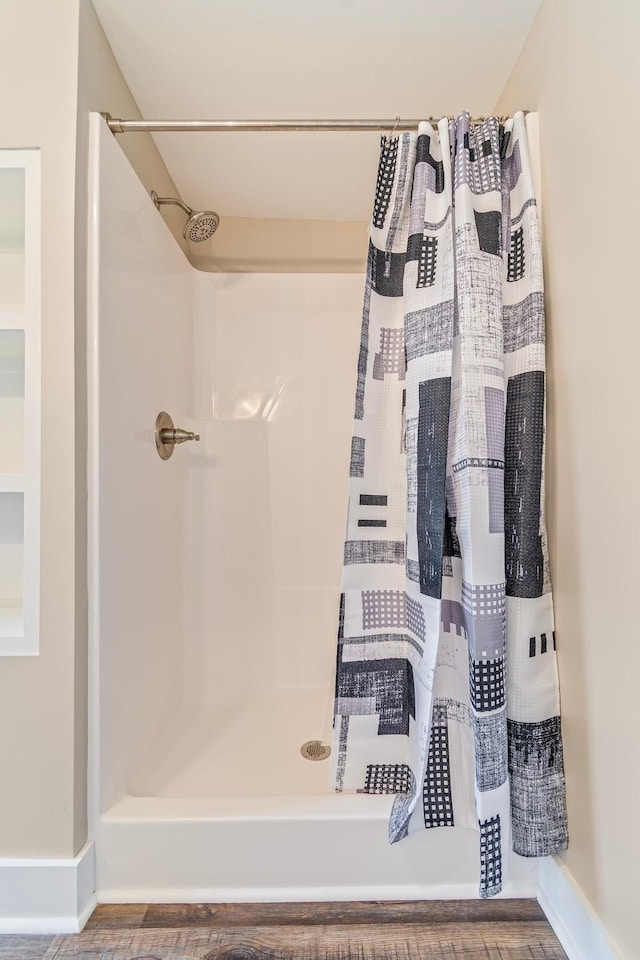 bathroom with a shower with shower curtain