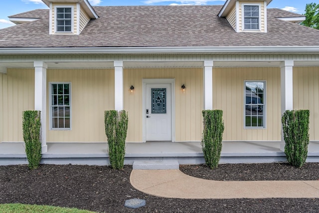 doorway to property featuring a porch