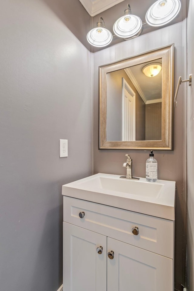 bathroom featuring vanity and ornamental molding