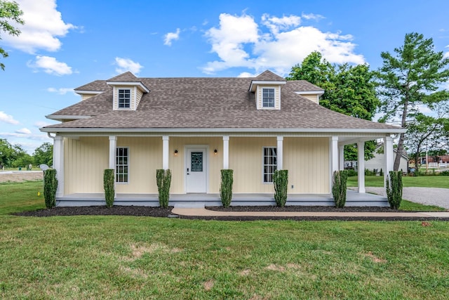 view of front of house with covered porch and a front yard