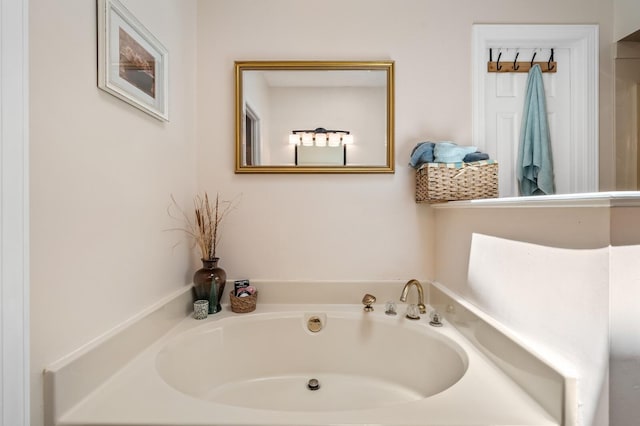 bathroom with a tub to relax in