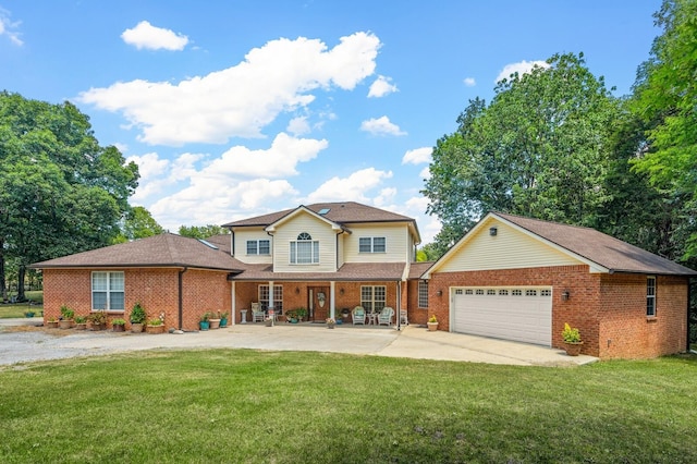 front of property with a garage and a front lawn