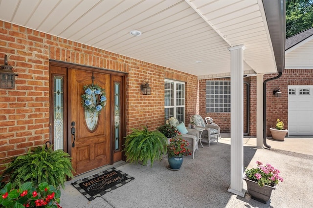 doorway to property featuring covered porch