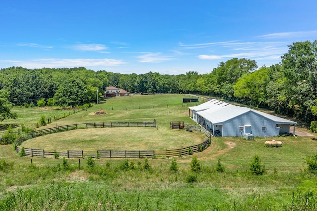 birds eye view of property with a rural view