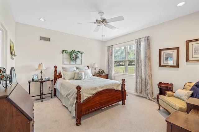 bedroom featuring light carpet and ceiling fan