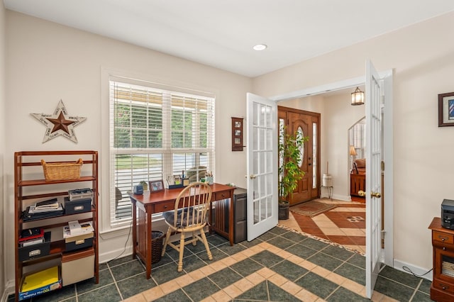 office area with french doors and dark tile patterned flooring