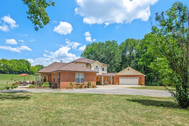 view of front of property featuring a garage and a front yard