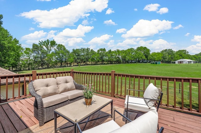 wooden deck featuring a yard and an outdoor hangout area