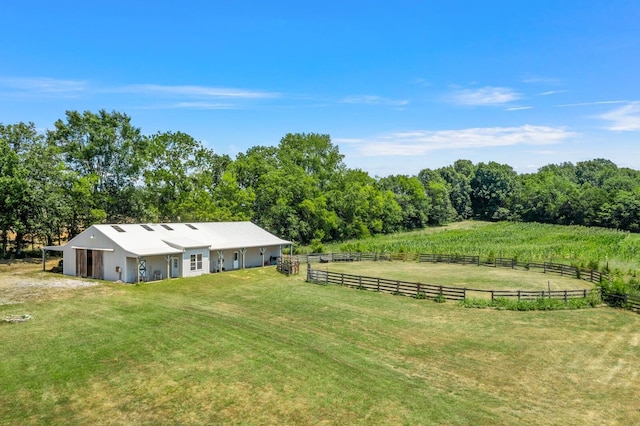 view of yard featuring an outbuilding and a rural view