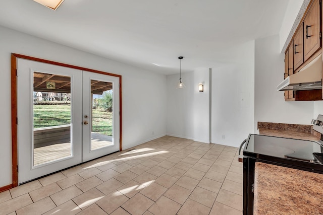 kitchen featuring french doors, black range with electric stovetop, pendant lighting, and light tile patterned flooring