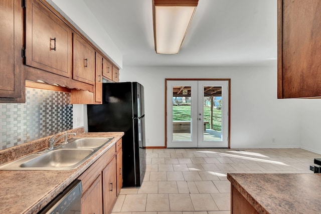 kitchen with french doors, backsplash, sink, light tile patterned floors, and dishwasher