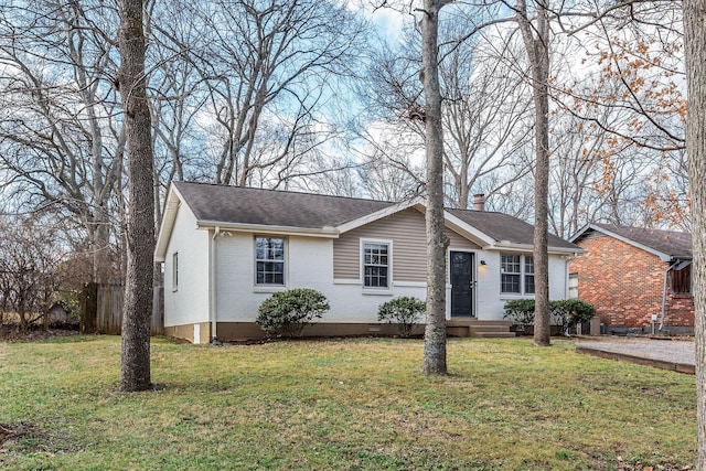 ranch-style home featuring a front yard