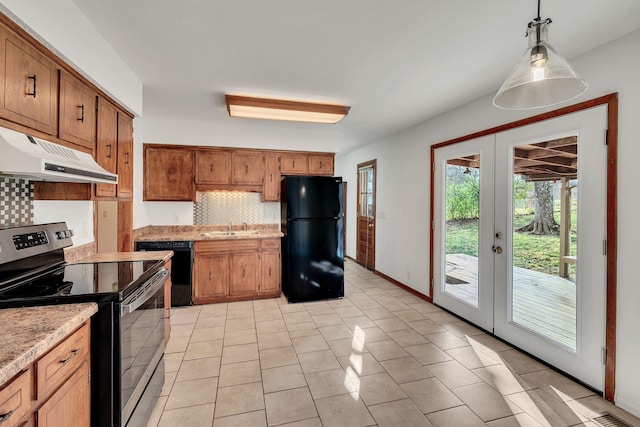 kitchen with french doors, sink, pendant lighting, decorative backsplash, and black appliances