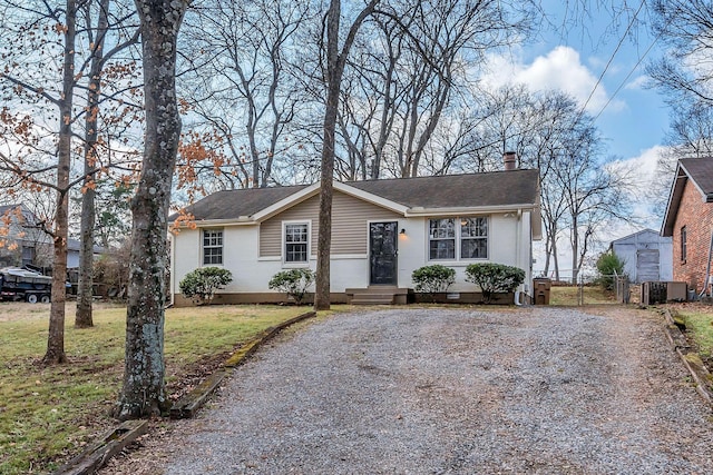 view of front of property featuring central AC unit and a front yard