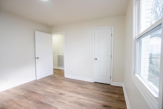 unfurnished bedroom featuring light hardwood / wood-style floors