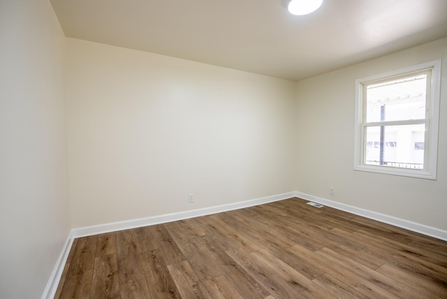 empty room featuring hardwood / wood-style flooring