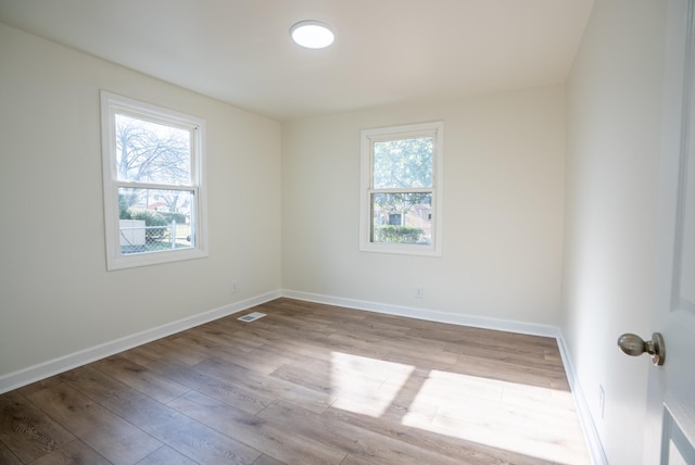 unfurnished room with light hardwood / wood-style flooring