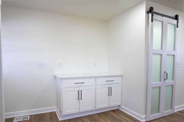 bathroom with hardwood / wood-style floors