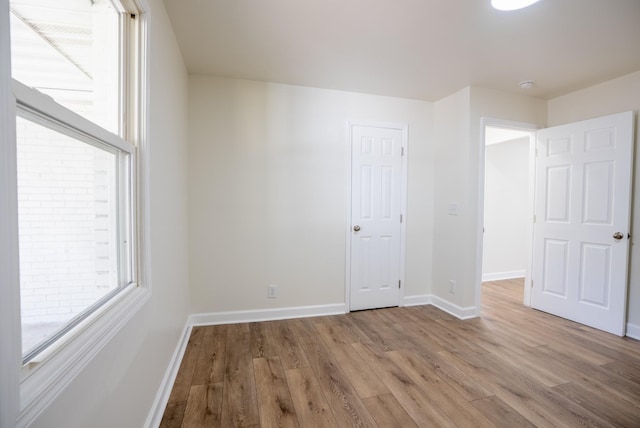 unfurnished room featuring light hardwood / wood-style floors